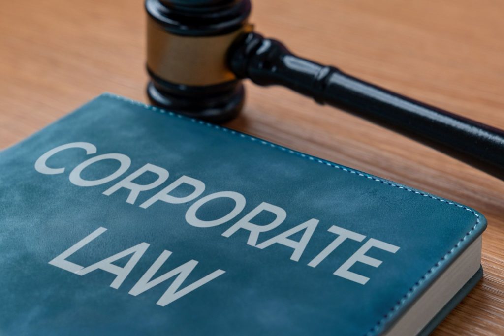 How do business laws affect company operations?