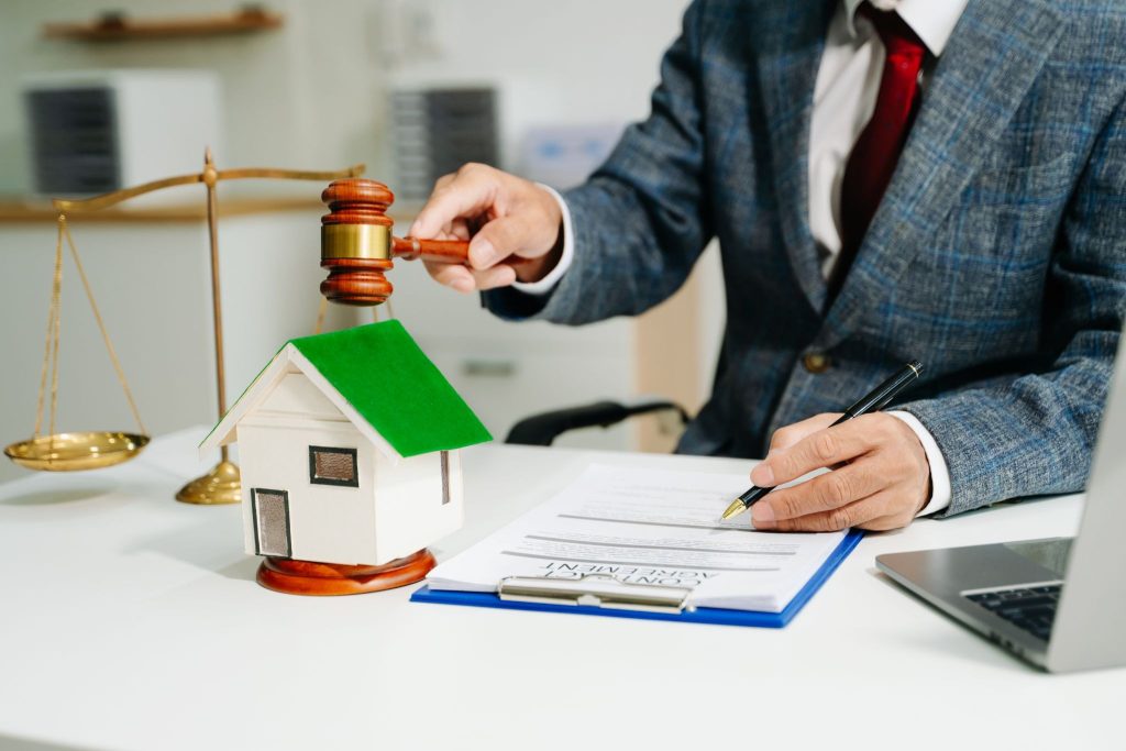 What does real estate law cover in property transactions?